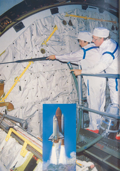 Two astronauts in white suits inspect a spacecraft interior; inset shows space shuttle launch with flames and blue sky.