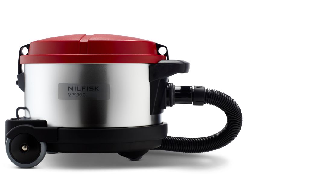 Red and silver cylinder vacuum cleaner by Nilfisk with black accents, hose, and wheels shown in a side view.