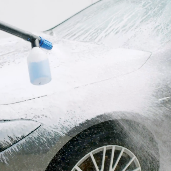 High-pressure cleaner detergent by Magic Wax being used on a gray car.