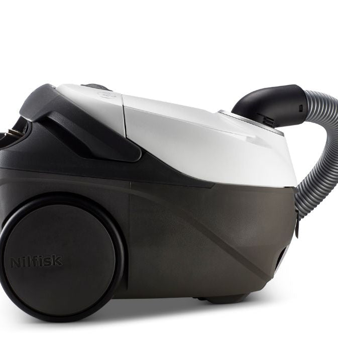 Black and white canister vacuum cleaner by Nilfisk, side view with flexible hose and large rear wheel, sleek plastic design
