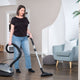 Støvsuger 650 W by ES Select on a hardwood floor in a contemporary living room.