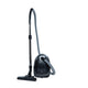 Black canister vacuum cleaner with flexible hose and floor nozzle, side view, by ES One Pet Care 750 W