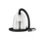 White canister vacuum cleaner by Nilfisk with black hose on a black background.