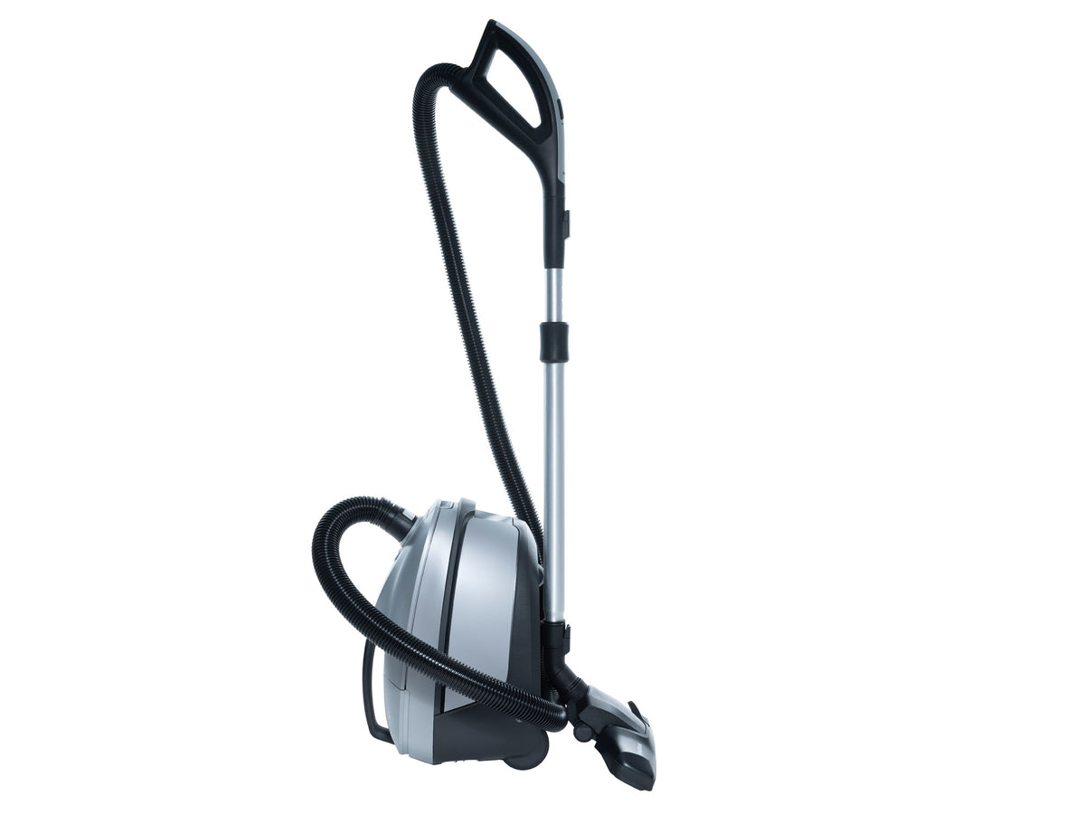 Silver and black canister vacuum cleaner with telescopic wand and flexible hose, side view, upright position