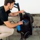 High pressure washer by ES Excellent with blue and black details, operated by a man on a paved surface.