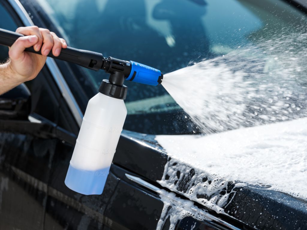Super foam sprayer for premium pressure washers by ES, attached to a black pressure washer wand.