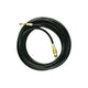 Black high-pressure washer from Nilfisk, coiled and featuring brass connectors.