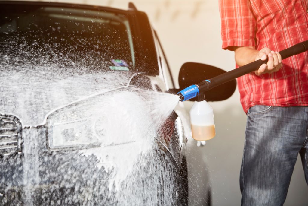 High pressure washer cleaning agent, 500 ml, washing a car with soapy foam.