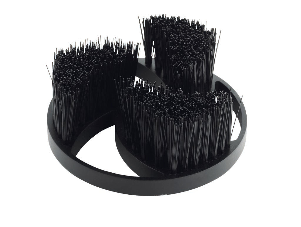 Black brush head for a multi-brush with three bristle sections attached to a circular base.