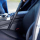 Wet and dry vacuum cleaner, 1200 W, with a black hose shown cleaning the interior of a car.