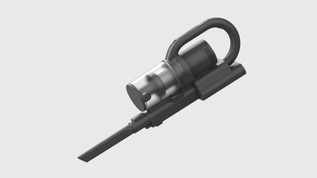 Black handheld vacuum with transparent dustbin, curved handle, and crevice tool attachment on light gray background.