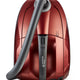 Red canister vacuum cleaner by Nilfisk, featuring a gray hose, and a streamlined design with a metallic finish.