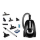 Black canister vacuum cleaner by Nilfisk, along with various attachments, a filter and a cartridge.
