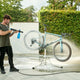 High-pressure washer with multi-functional nozzle by ES Excellent, used outdoors for bicycle washing.